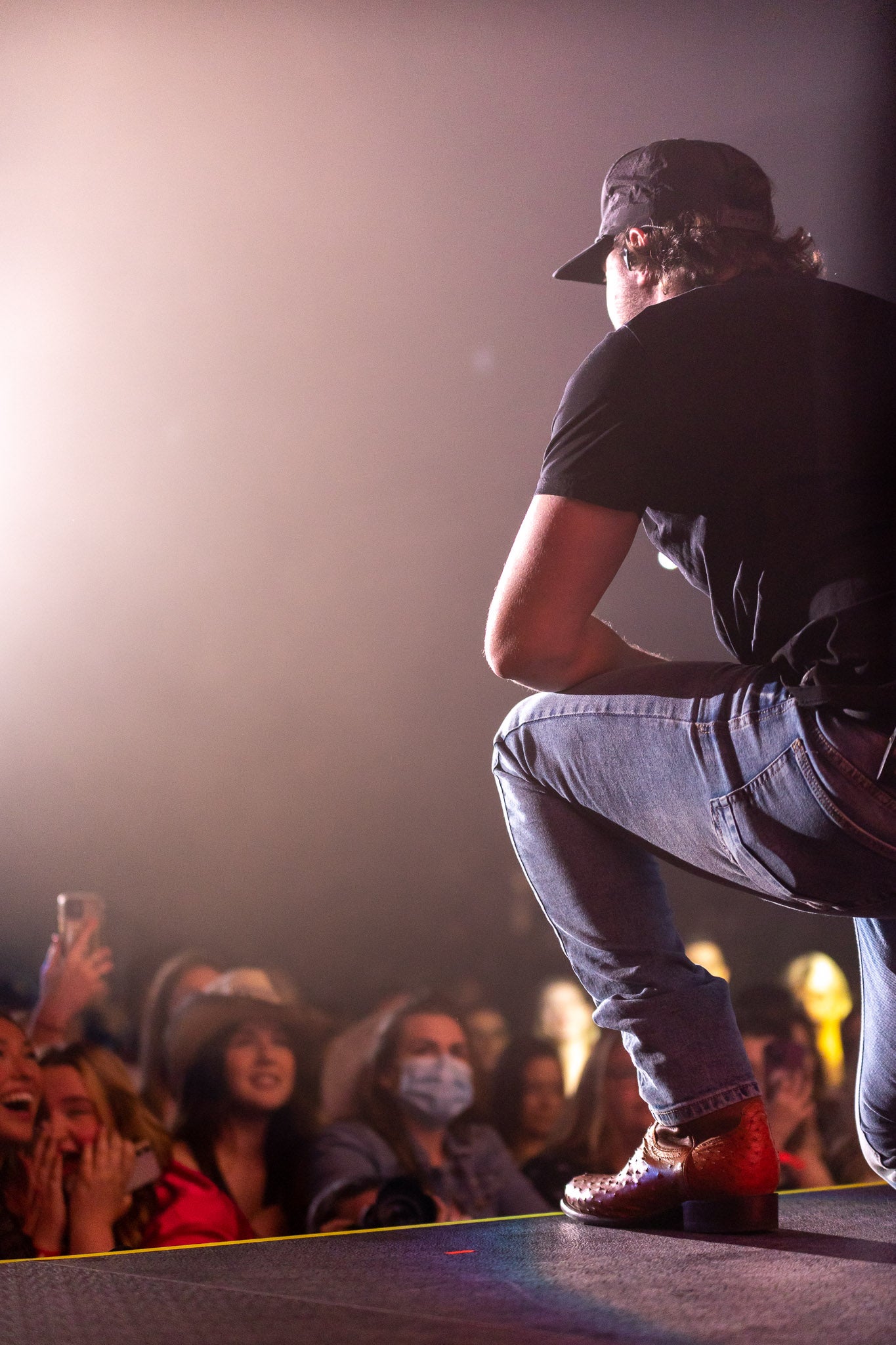 Josh Ross kneeling in front of crowd